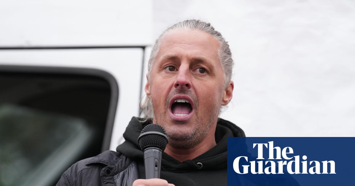 Leader of group behind flag campaign in England charged with 14 offences