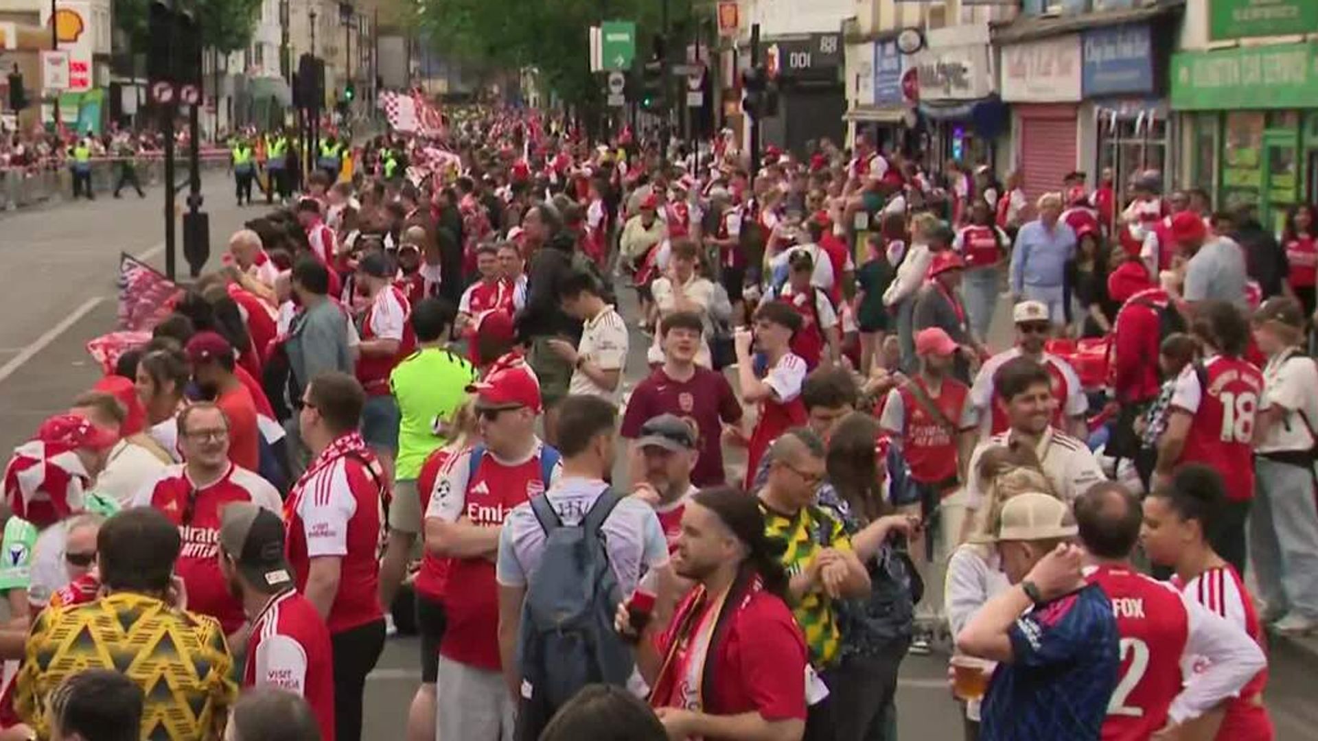 Arsenal fans line the streets in North London ahead of Premier League trophy parade