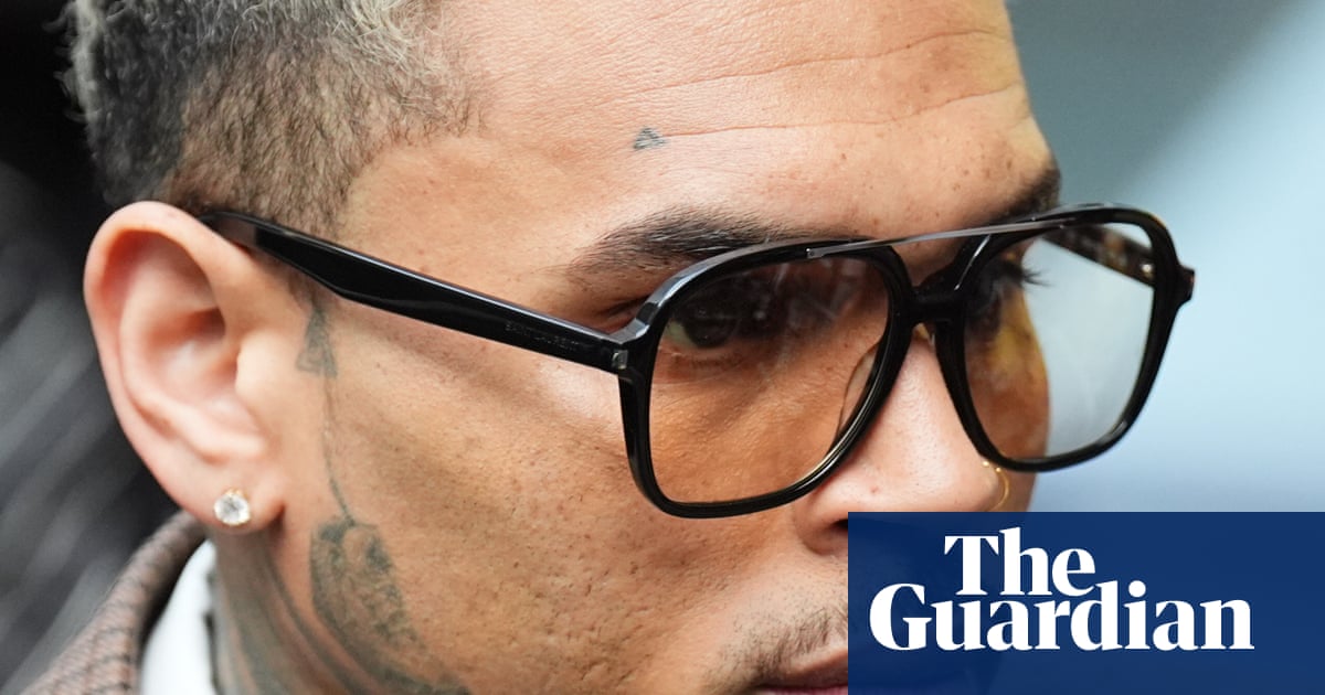 R&B star Chris Brown ordered to pay $13m to housekeeper mauled by his dog