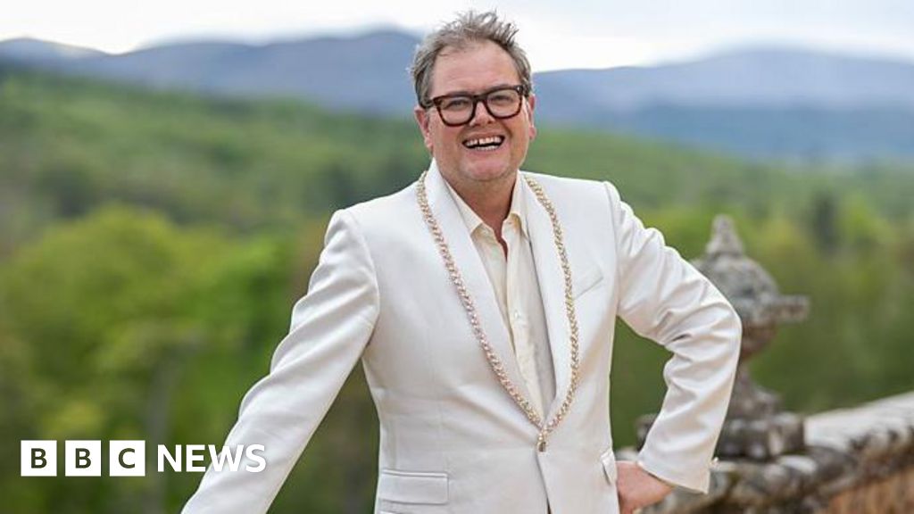 Why has Alan Carr bought a castle and where is it?