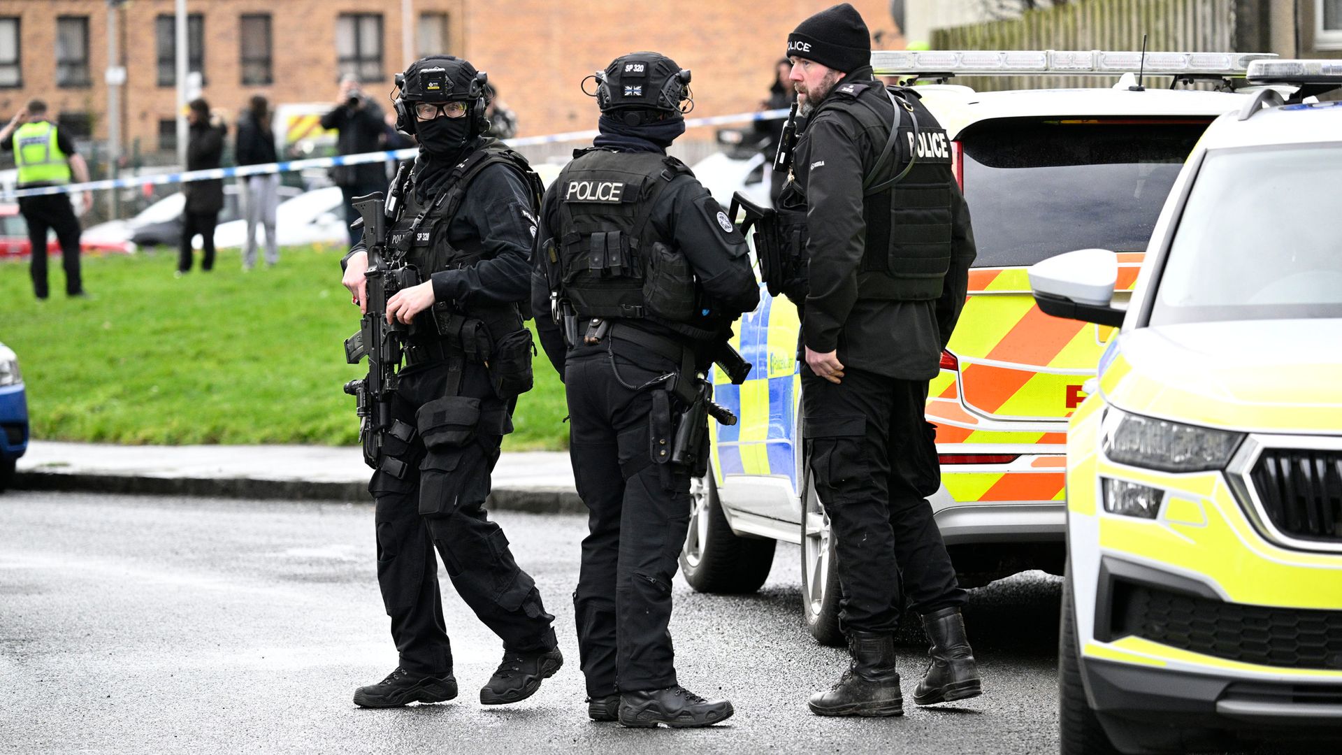 Man arrested after tower block stand-off following knife incident that left two in hospital