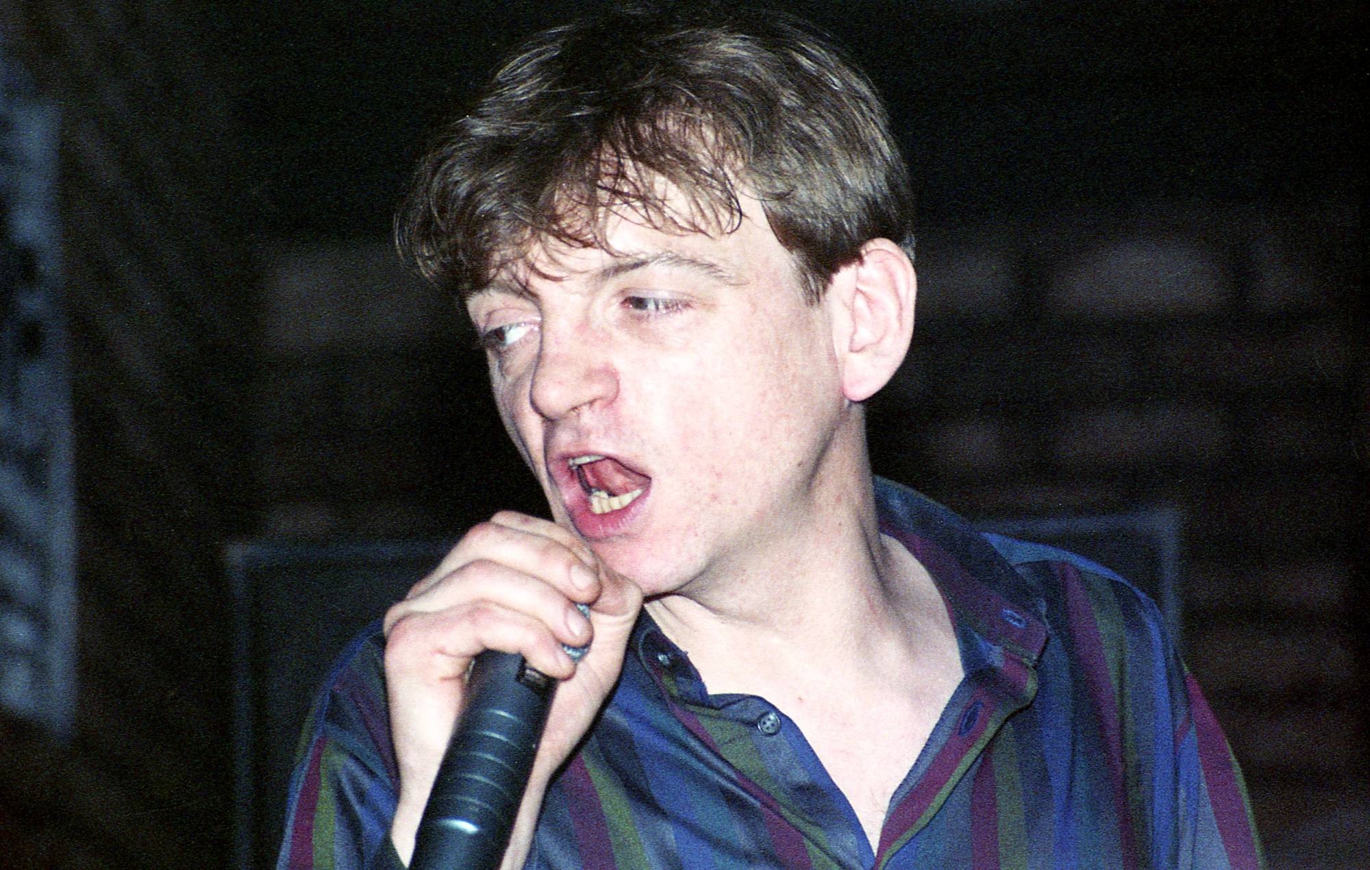 Mark E Smith’s fiancée and last manager hits out at The Fall’s final album as “cash grab” and “ethically wrong”