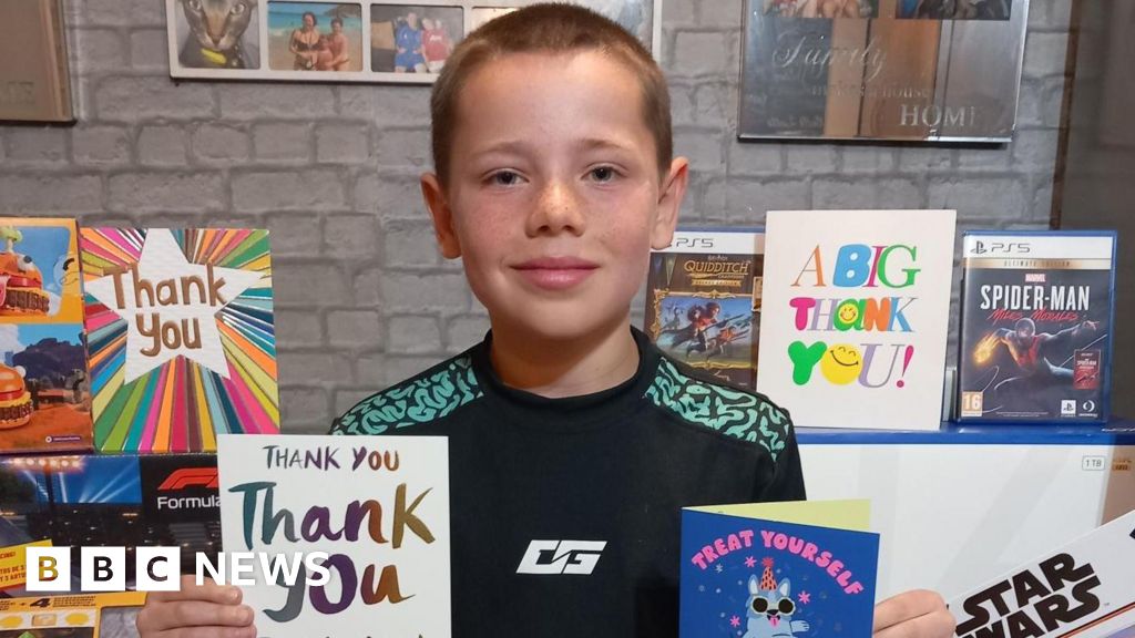 Boy, 8, showered with gifts after calming plane passenger with singing and football cards