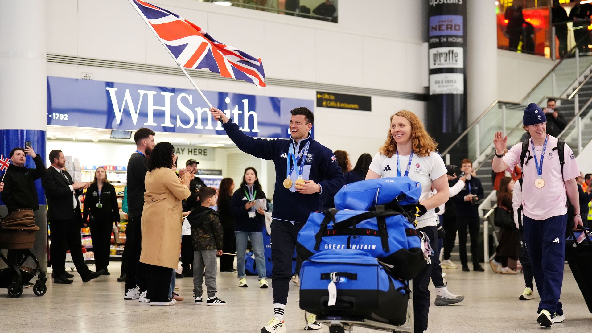 Jubilant Team GB return home after record-breaking Winter Olympics