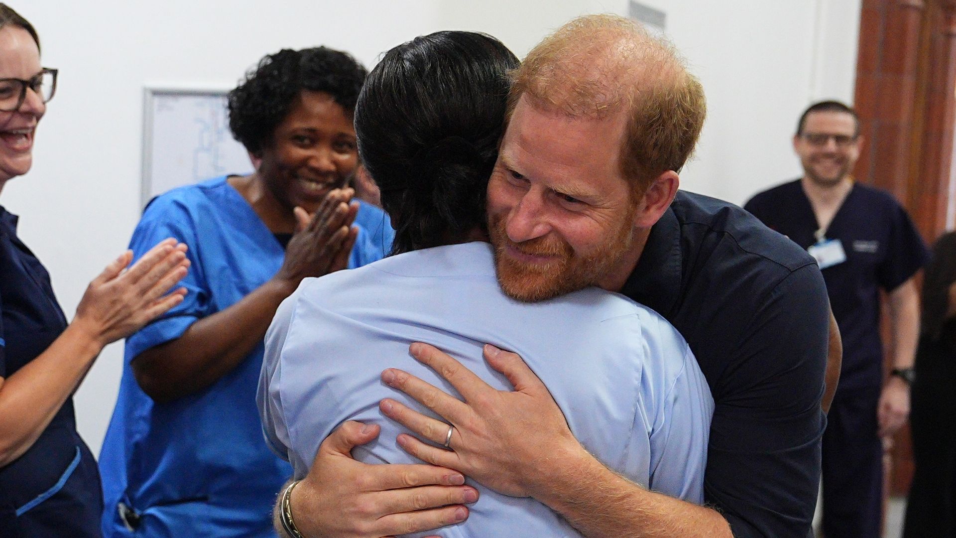 Prince Harry visits hospital as William plays crazy golf and Charles examines a penguin